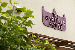 San Jose apartment for rent - a sign for the grafted house on the side of a building