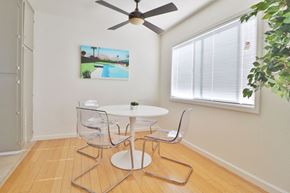 Belmont apartment for rent - a dining room with a table and chairs and a ceiling fan