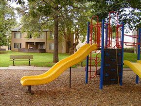 Gresham apartment for rent - a playground with a slide and other toys in a park