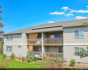 Bend apartment for rent - an apartment building with a porch and balconies