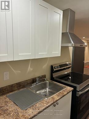 Ajax (Northwest Ajax) house for rent - A kitchen with a stove, oven, and sink.