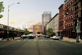 Hoboken apartment for rent - A city street with cars and buildings in the background.
