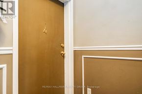 Ottawa condo for rent - A brown door with the number 14 on it.
