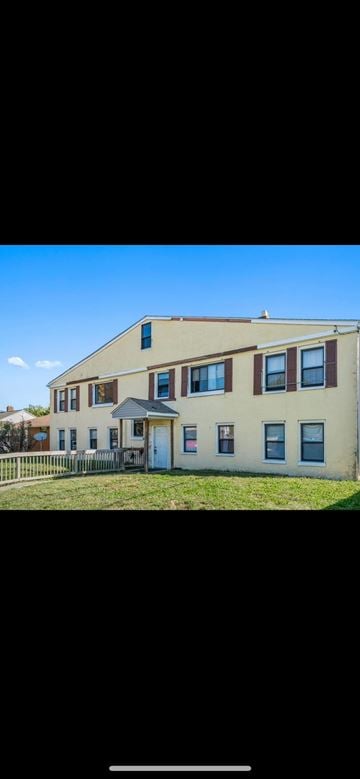 Columbus apartment for rent - A two-story building with a green lawn in front.