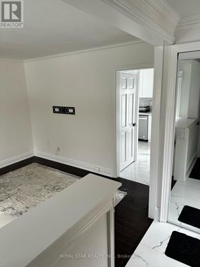 Toronto (Lansing-Westgate) house for rent - A white room with a black and white rug on the floor.