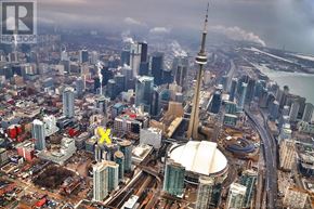 Toronto (Waterfront Communities) condo for rent - A cityscape with a prominent yellow X on a building.
