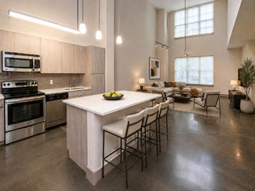 New Orleans apartment for rent - A modern kitchen with a large island and stainless steel appliances.