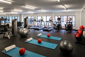 Brooklyn apartment for rent - a gym with exercise equipment and yoga mats