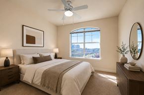 New Orleans apartment for rent - Crescent Club Bedroom with Arch Window, Bed, Nightstands, and Dresser in Neutral Palette