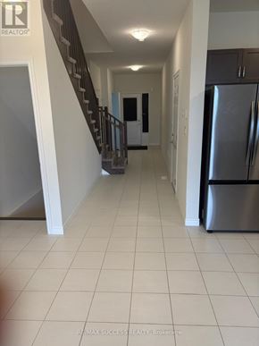Hamilton townhouse for rent - A kitchen with a sink and cabinets.