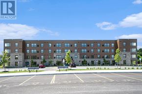 Arnprior condo for rent - A large building with a parking lot in front of it.