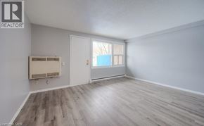 Kitchener townhouse for rent - A room with a window and a door is available for rent.