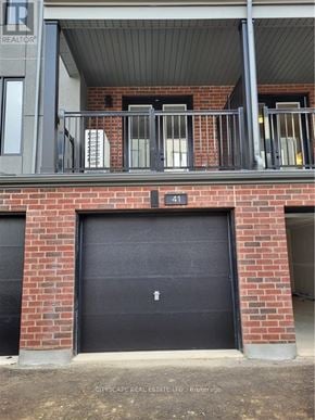 Waterloo townhouse for rent - A black door with a white number 1 on it.
