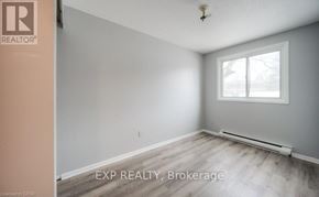 Kitchener townhouse for rent - A room with a window and a radiator on the floor.
