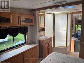 Northern Bruce Peninsula mobile home for rent - A bathroom with a shower and a window.