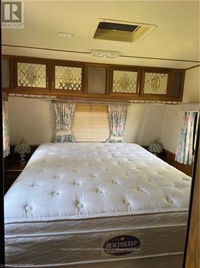 Northern Bruce Peninsula mobile home for rent - A bed with a BeautySleep mattress label on it.
