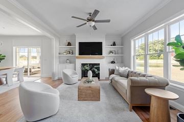 Bellingham apartment for rent - A living room with a fireplace, a television, and a couch.