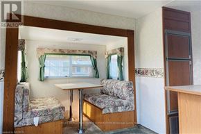 Northern Bruce Peninsula mobile home for rent - A small room with a table and two chairs.