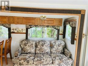 Northern Bruce Peninsula mobile home for rent - A camper with a couch and a window.