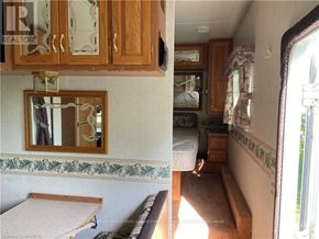 Northern Bruce Peninsula mobile home for rent - A view of a bedroom with a bed, dresser, and mirror.