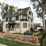 Colorado Springs apartment for rent - A house with a black roof and white walls.
