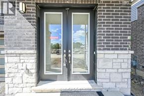 Hamilton house for rent - A glass door with a sign that says "SOLD" on it.