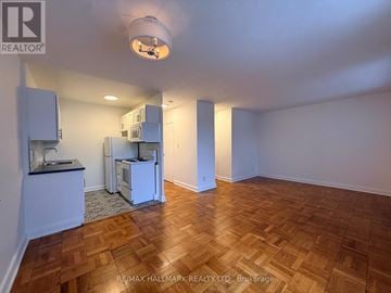 Toronto (Mount Pleasant East) condo for rent - A kitchen area with a sink and a refrigerator.