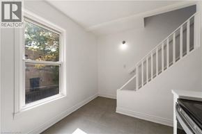 Hamilton apartment for rent - A room with a staircase and a window.