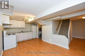 Mississauga (Meadowvale) house for rent - A real estate listing photo of a kitchen and living room.
