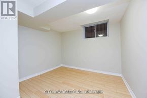 Mississauga (Meadowvale) house for rent - A room with a window and wooden flooring.