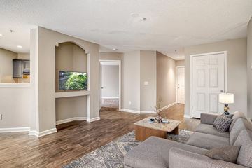 Charlotte apartment for rent - A living room with a grey couch and a television.