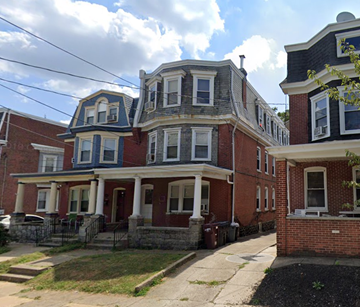 Wilmington apartment for rent - A row of houses with a mix of brick and siding exteriors.