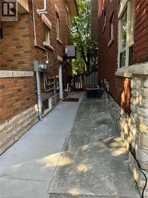 Brantford house for rent - A brick building with a Realtor sign on the top left corner.