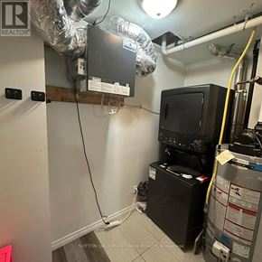 Ottawa triplex for rent - A room with a furnace and air conditioner unit.