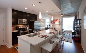 Atlanta apartment for rent - a kitchen with a large island and a counter top