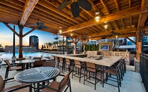 Atlanta apartment for rent - the patio of a restaurant with a bar and a pool