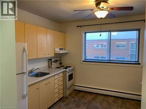 Cambridge apartment for rent - A kitchen with a refrigerator, sink, stove, and oven.