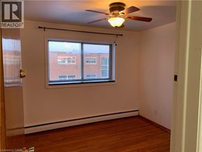 Cambridge apartment for rent - A room with a window and a ceiling fan.