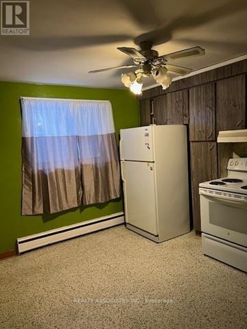 Toronto (Oakridge) house for rent - A kitchen with a white refrigerator, a white stove, and a ceiling fan.