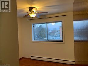 Cambridge apartment for rent - A room with a window and a ceiling fan.