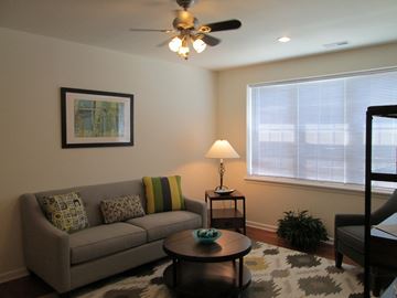 Newport News apartment for rent - a living room with a couch and a ceiling fan