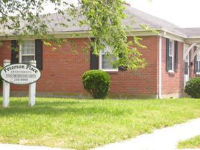 Newport News apartment for rent - a brick building with a sign in front of it