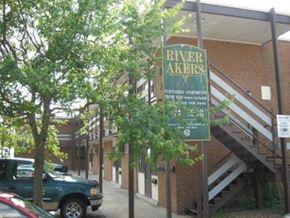 Newport News apartment for rent - a sign for river akers in front of a building