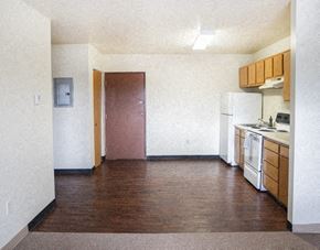 North Versailles apartment for rent - an empty kitchen with a stove and a refrigerator