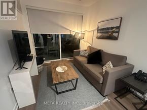Gravenhurst (Muskoka (S)) condo for rent - A living room with a couch, coffee table, and television.
