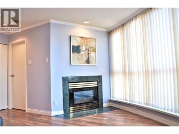 Richmond apartment for rent - A living room with a fireplace and a painting on the wall.