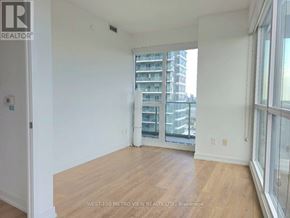 Toronto (Bayview Village) condo for rent - A room with a view of a building across the street.