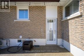 Oakville (Wo West) house for rent - A house with a white door and a window is shown.