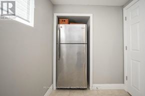 Oakville (Wo West) house for rent - A stainless steel refrigerator in a room with white walls.