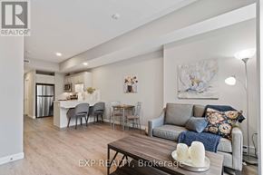 For rent in Perth - A living room with a grey couch and a wooden coffee table.